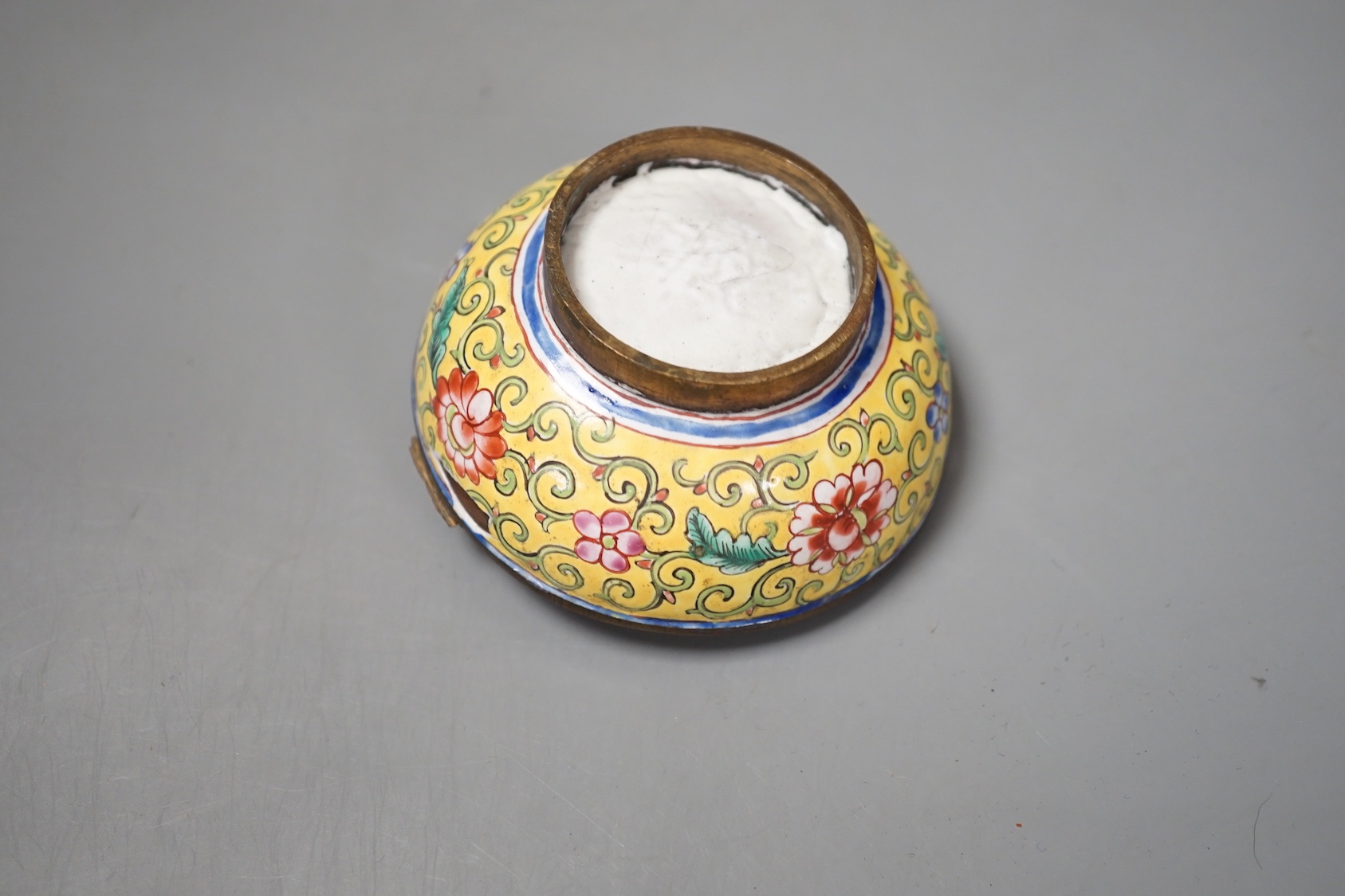 A Canton enamel tea bowl, snuff bottle, and a cloisonne enamel jar and cover